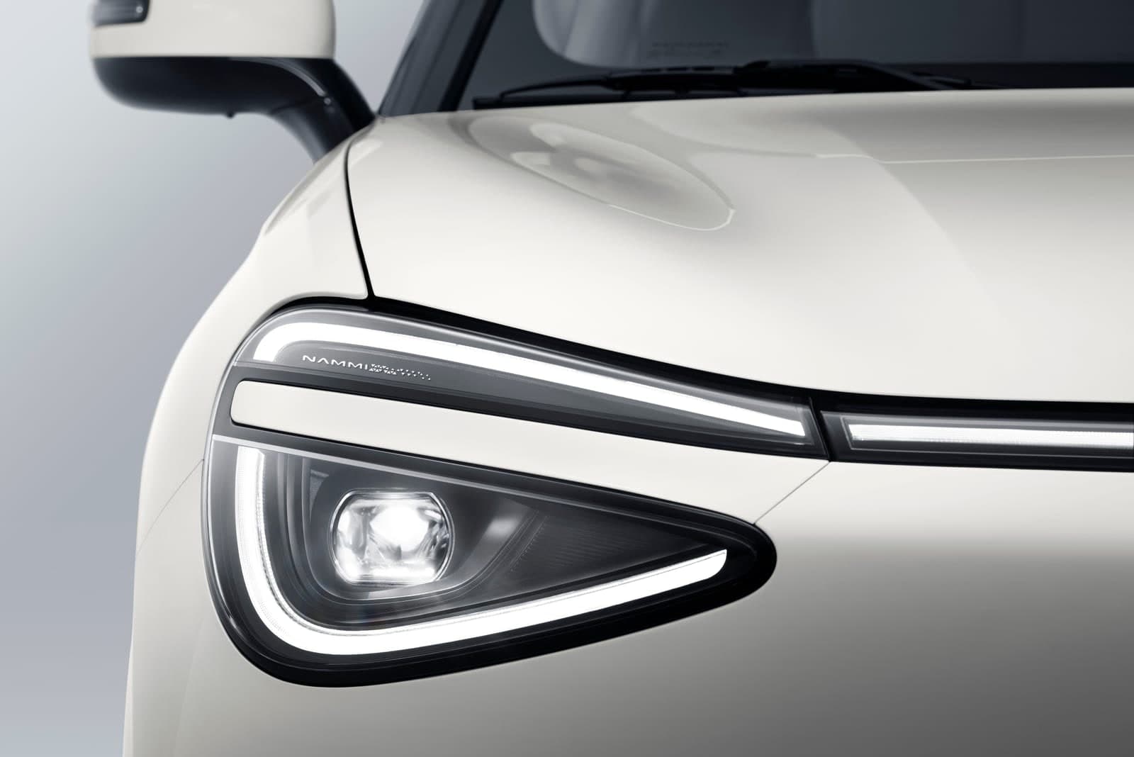 Dongfeng BOX — white car headlight detail close-up